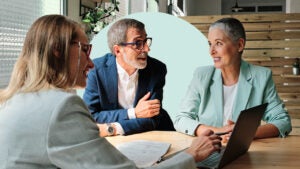 Financial advisor meeting with clients.