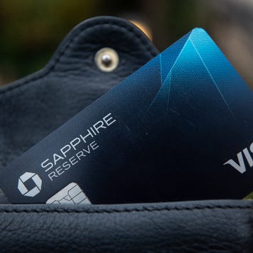 Chase Sapphire Reserve card sticking out from black leather wallet