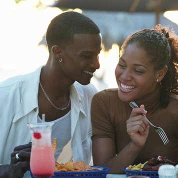 Smiling couple at outdoor restaurant