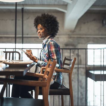 Woman online banking with a tablet