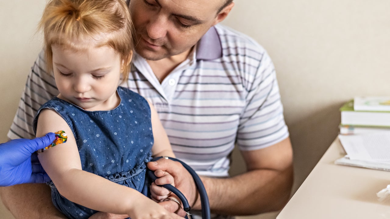 A little girl gets a vaccination.