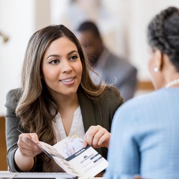 Bank teller with customer