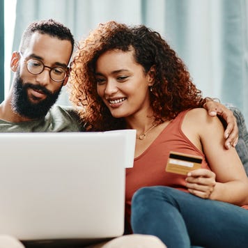 Couple looking at credit card offers online