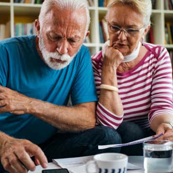 Senior couple managing finances