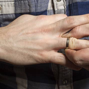 Man removing wedding ring
